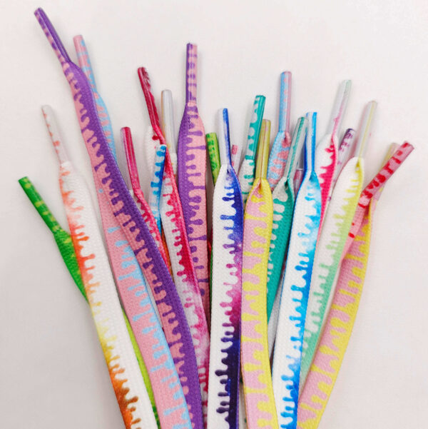 Multiple ice cream laces displayed from tip to mid-length, showing vibrant drip patterns in assorted colors